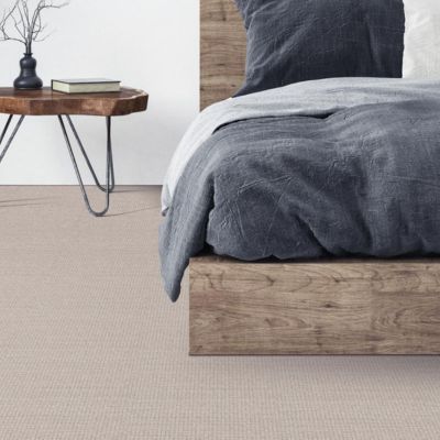 textured beige carpets in a bedroom